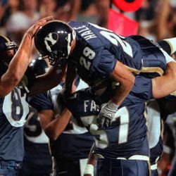 BYUÕs Chris Hale is carried on his teammate's shoulders and patted on the head after catching the winning touchdown pass, Thursday, Sept 9, 1999 at Cougar Stadium in Provo. PHOTO BY CHUCK WING/DESERET NEWS