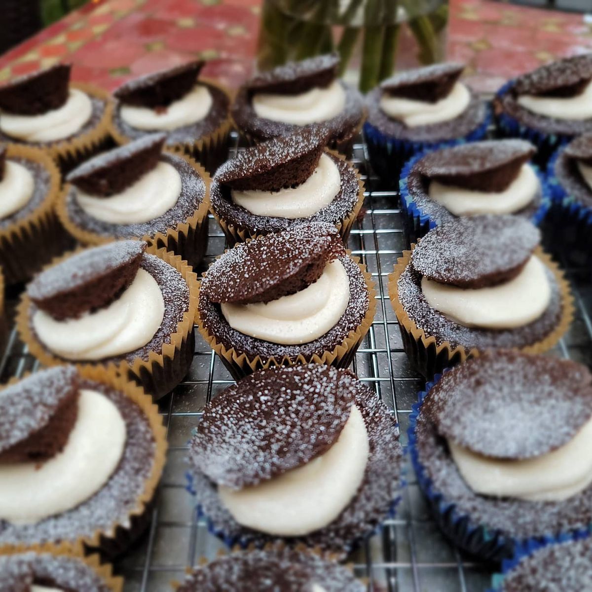 Rows of mini Mama’s stuffed chocolate cakes topped with cream cheese and chocolate cookies is based on a century-old family recipe from the Bronx Bagel Buggy in Chamblee, GA.