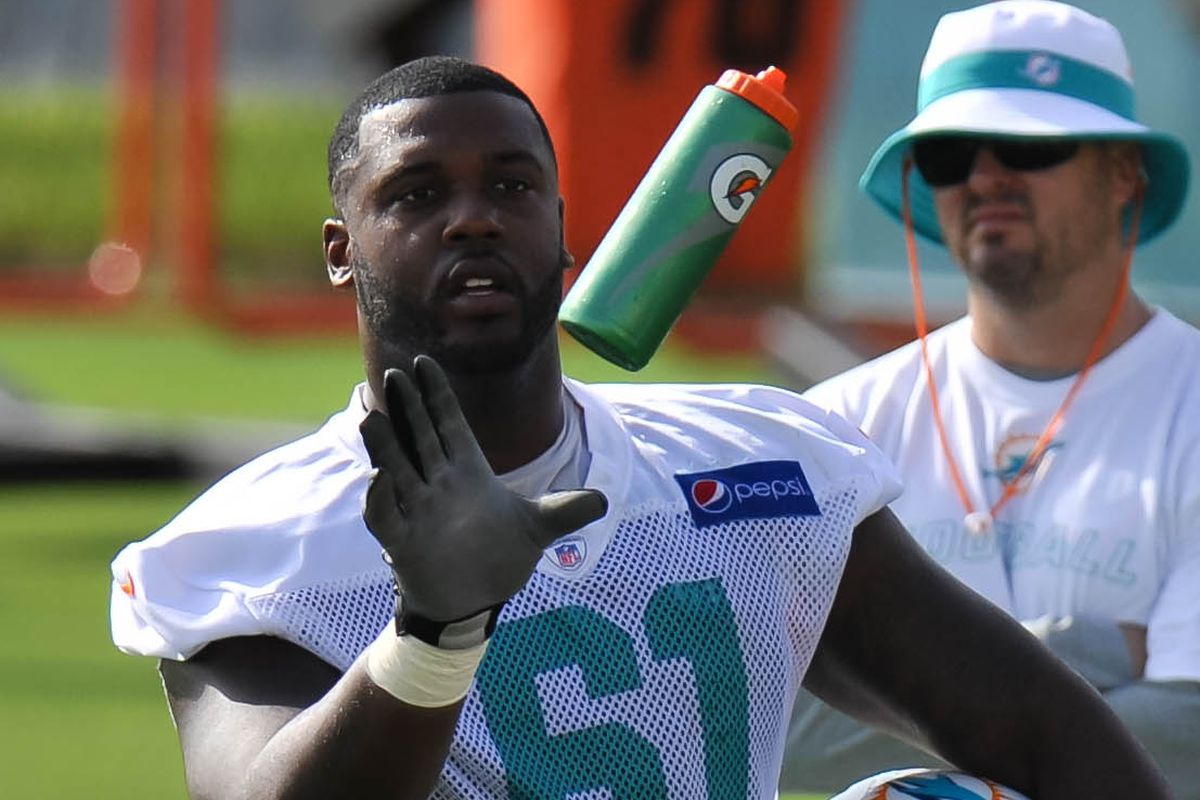 Miami Dolphins offense linemen Donald Hawkins (61) takes a drink during practice drills at Doctors Hospital Training Facility.