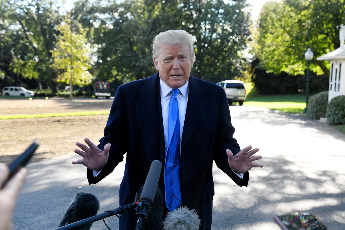 Trump speaks to reporters on the South Lawn of the White House in October 2018.