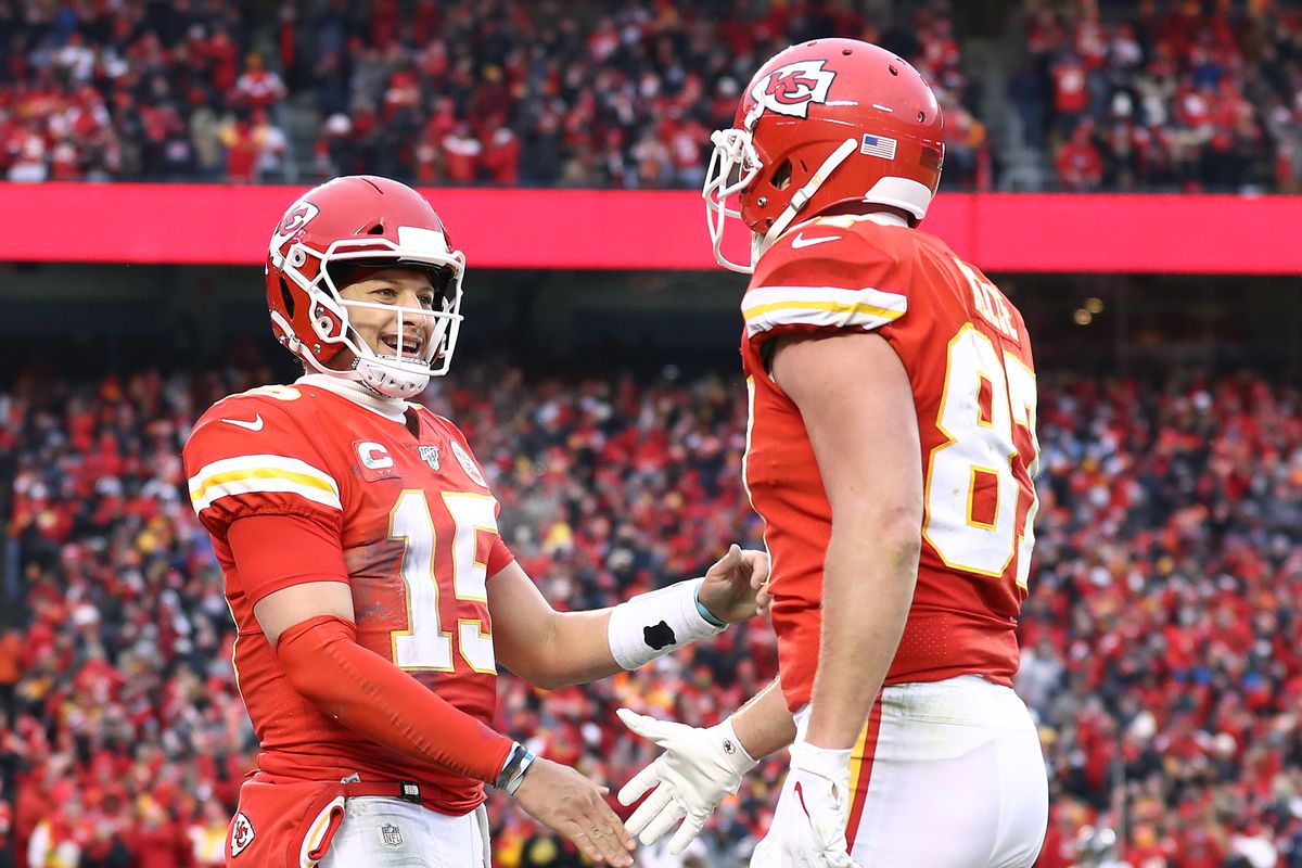 Patrick Mahomes of the Kansas City Chiefs is congratulated by his teammate Travis Kelce after a third quarter touchdown against the Houston Texans in the AFC Divisional playoff game at Arrowhead Stadium on January 12, 2020 in Kansas City, Missouri.