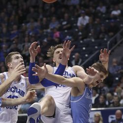 Brigham Young Cougars guard Zac Seljaas (2) gets tangled up with San Diego Toreros guard Joey Calcaterra (2) in Provo on Thursday, Jan. 16, 2020. BYU won 93-70.