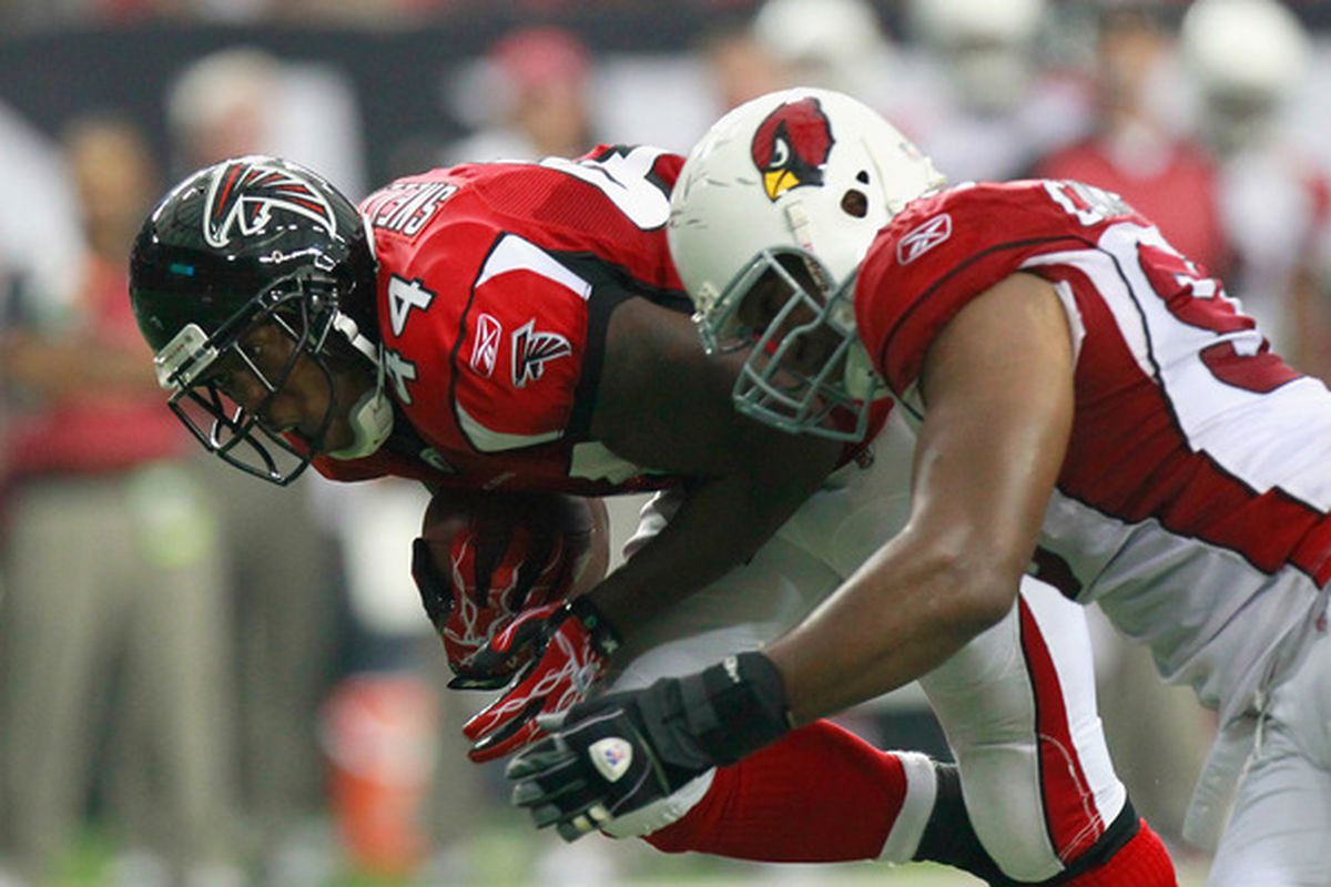 ATLANTA - SEPTEMBER 19:  Jason Snelling #44 of the Atlanta Falcons is tackled by Calais Campbell #93 of the Arizona Cardinals at Georgia Dome on September 19 2010 in Atlanta Georgia.  (Photo by Kevin C. Cox/Getty Images)