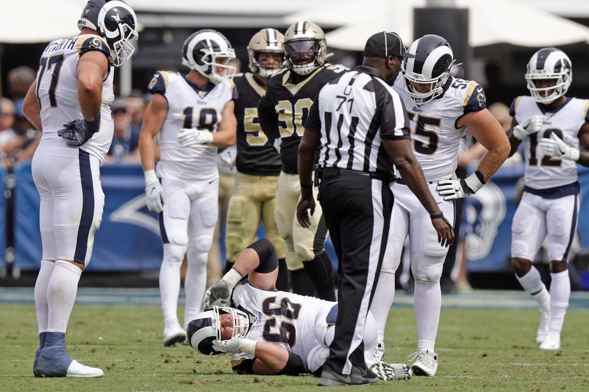 Los Angeles Rams RG lies Austin Blythe injured on the field at the Los Angeles Memorial Coliseum in a Week 2 game against the New Orleans Saints, Sep. 15, 2019.