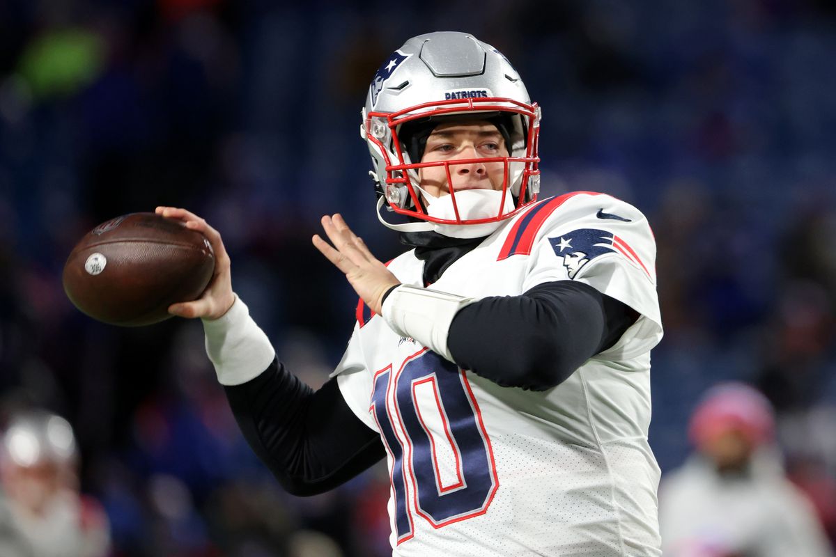 Mac Jones #10 of the New England Patriots throws a pass before a game against the Buffalo Bills at Highmark Stadium on December 6, 2021 in Orchard Park, New York.
