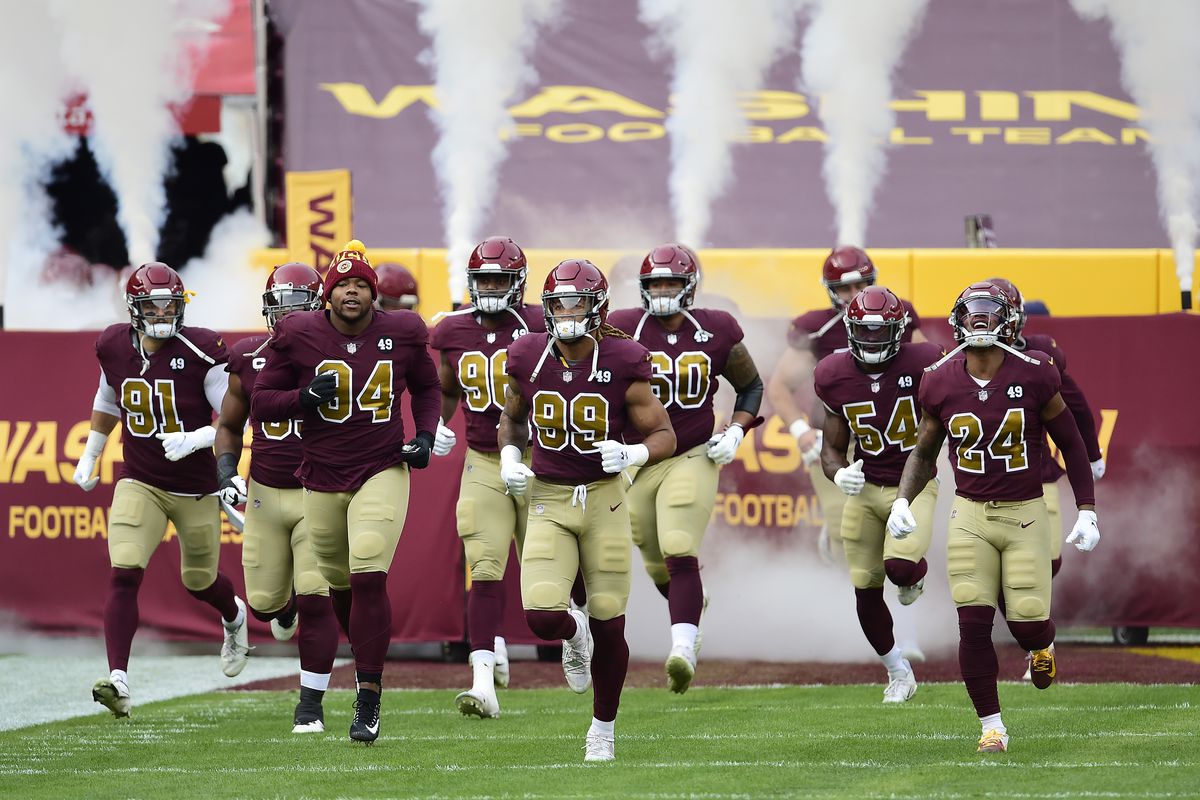 Chase Young #99 of the Washington Football Team leads his teammates onto the field before a game against the Cincinnati Bengals at FedExField on November 22, 2020 in Landover, Maryland.