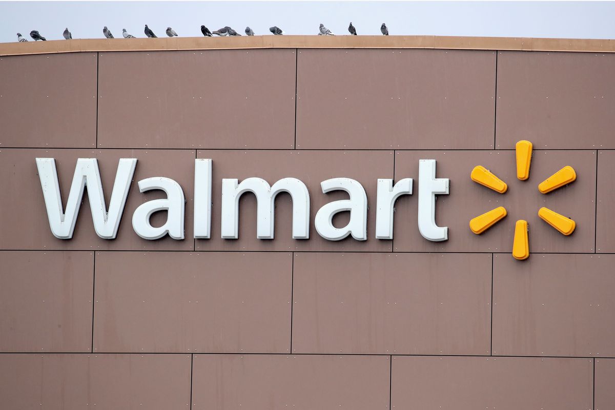 A sign hangs outside Walmart store on January 11, 2018 in Chicago, Illinois.