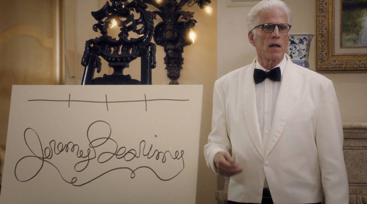 Ted Danson next to a sign that says Jeremy Bearimy, on The Good Place. 