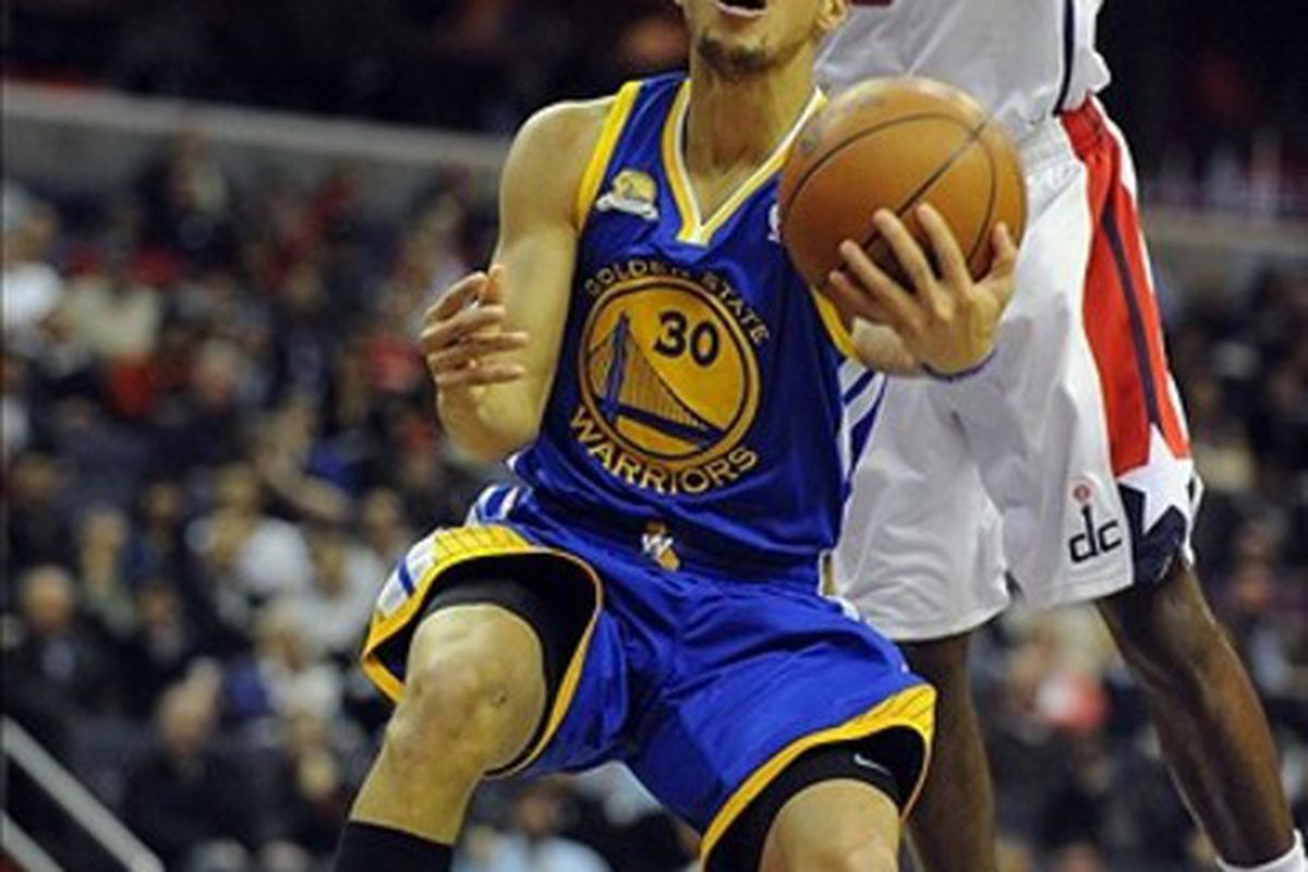 Stephen Curry's fast break layup in the second half of the Golden State Warriors' 120 - 100 over the Washington Wizards made Jim Barnett happy. <em>Brad Mills-US PRESSWIRE</em>