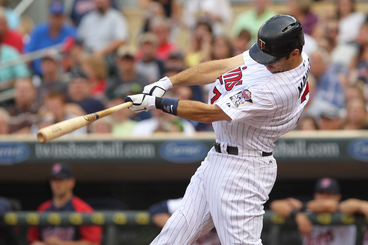 Minneapolis, MN, USA; Minnesota Twins catcher Joe Mauer (7) against the Cleveland Indians at Target Field. The Twins defeated the Indians 12-5. Mandatory Credit: Brace Hemmelgarn-US PRESSWIRE