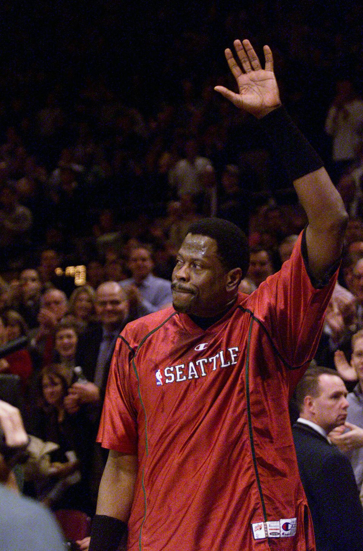 Seattle Supersonics’ Patrick Ewing waves to the crowd after