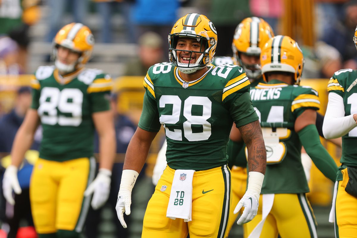 AJ Dillon of the Green Bay Packers laughs prior to the game against the Minnesota Vikings at Lambeau Field on October 29, 2023 in Green Bay, Wisconsin.
