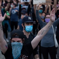 Protesters wrote numbers on their bodies in case they were arrested and their phones confiscated, June 2, 2020.