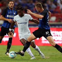 Michy Batshuayi of Chelsea FC competes for the ball with Milan Skriniar of FC Internazionale during the International Champions Cup match between FC Internazionale and Chelsea FC at National Stadium on July 29, 2017 in Singapore.
