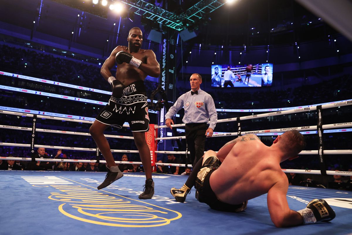 Lawrence Okolie knocks down Dilan Prasovic during the WBO World Cruiserweight title fight between Lawrence Okolie and Dilan Prasovic at Tottenham Hotspur Stadium on September 25, 2021 in London, England.