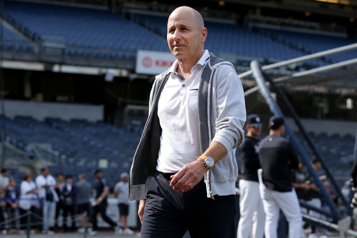 New York Yankees general manager Brian Cashman on the field during batting practice before a game against the Seattle Mariners at Yankee Stadium.