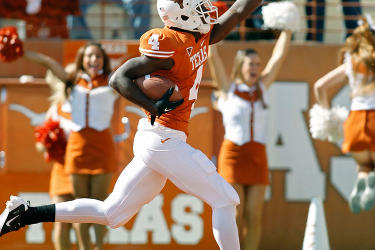Pictures of Darius White with the football in his hands at Texas are not easy to come by. There will be no more produced in the future. (Photo by Erich Schlegel/Getty Images)