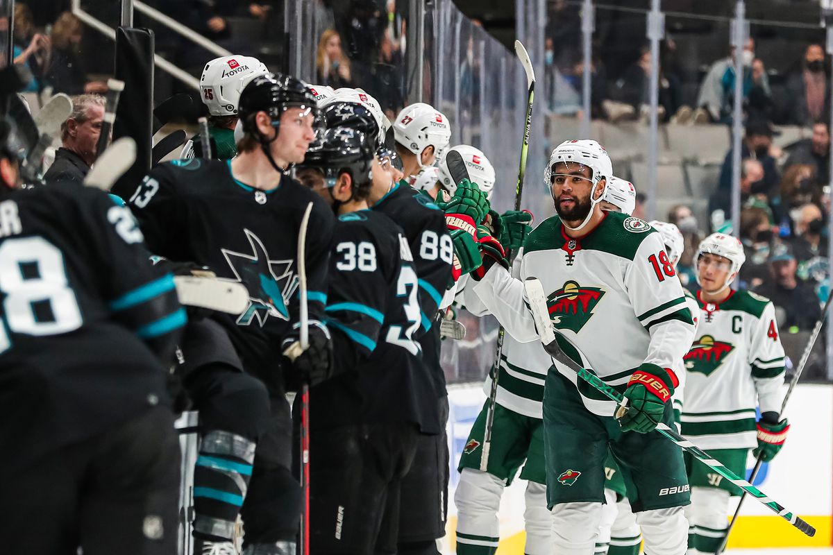 Jordan Greenway #18 of the Minnesota Wild, celebrates with teammates after scoring a second period goal against the San Jose Sharks, in a regular season game at SAP Center on December 9, 2021 in San Jose, California.