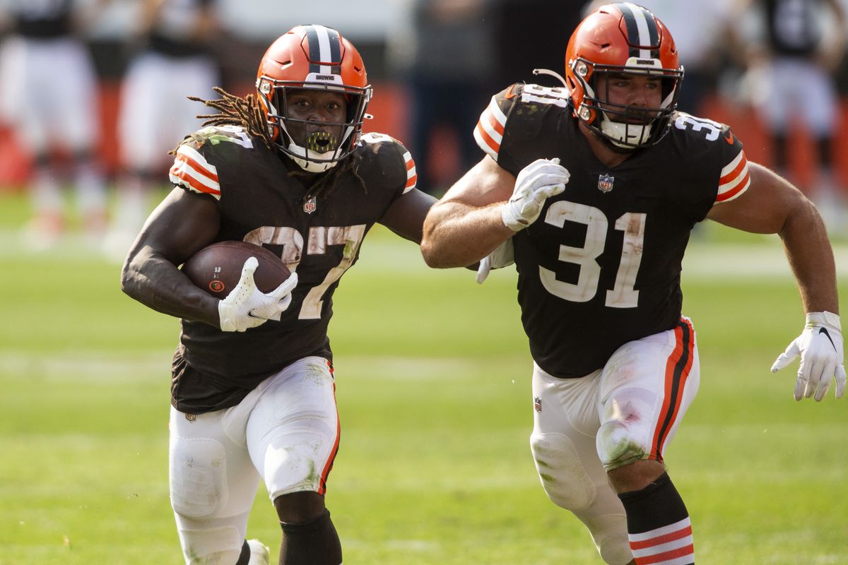 Cleveland Browns running back Kareem Hunt (27) runs the ball as running back Andy Janovich (31) blocks for him against the Washington Football Team during the fourth quarter at FirstEnergy Stadium. The Browns won 34-20.&nbsp;