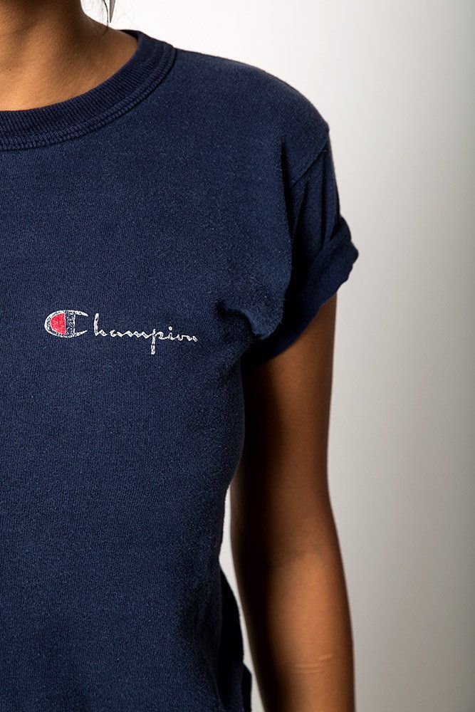 A vintage navy cotton Champion logo t-shirt worn on a model