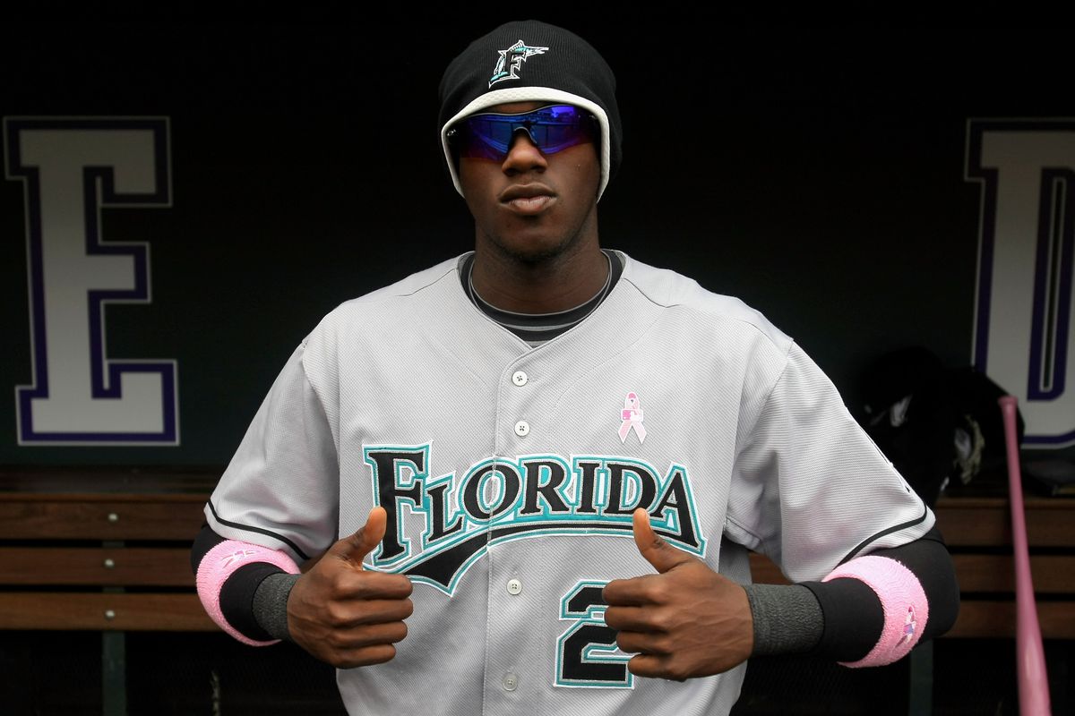 Cameron Maybin #24 of the Florida Marlins shows off his pink accessories in support of the “Going To Bat Against Breast Cancer” promotion prior to facing the Colorado Rockies during MLB action at Coors Field