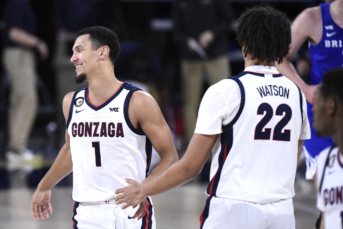 Gonzaga Bulldogs guard Jalen Suggs and Gonzaga Bulldogs forward Anton Watson celebrate a basket against the Brigham Young Cougars in the second half of a WCC men s basketball game at McCarthey Athletic Center.