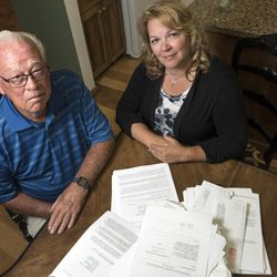 A pile of paperwork regarding a fraud case clutters the dining room table in Suzanne Rengers' home in West Jordan on Tuesday, Sept. 27, 2016. Rengers and her father, Frank Arnold Horton, say they were both scammed by their tax preparer and financial manager,