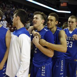 Dixie celebrates its win over Desert Hills in the 3A boys basketball semifinals at the Maverik Center in West Valley City Friday, Feb. 27, 2015.
