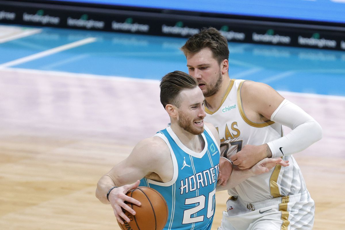 Gordon Hayward of the Charlotte Hornets drives to the basket against Luka Doncic of the Dallas Mavericks during the second quarter of their game at Spectrum Center on January 13, 2021 in Charlotte, North Carolina.