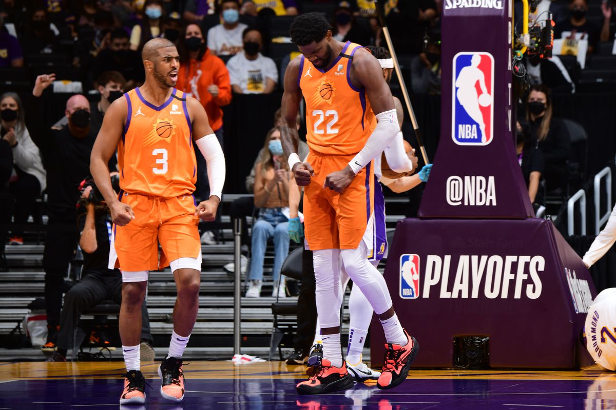 Chris Paul and Deandre Ayton of the Phoenix Suns celebrate during the game against the Los Angeles Lakers during Round 1, Game 4 of the 2021 NBA Playoffs on May 30, 2021 at STAPLES Center in Los Angeles, California.&nbsp;
