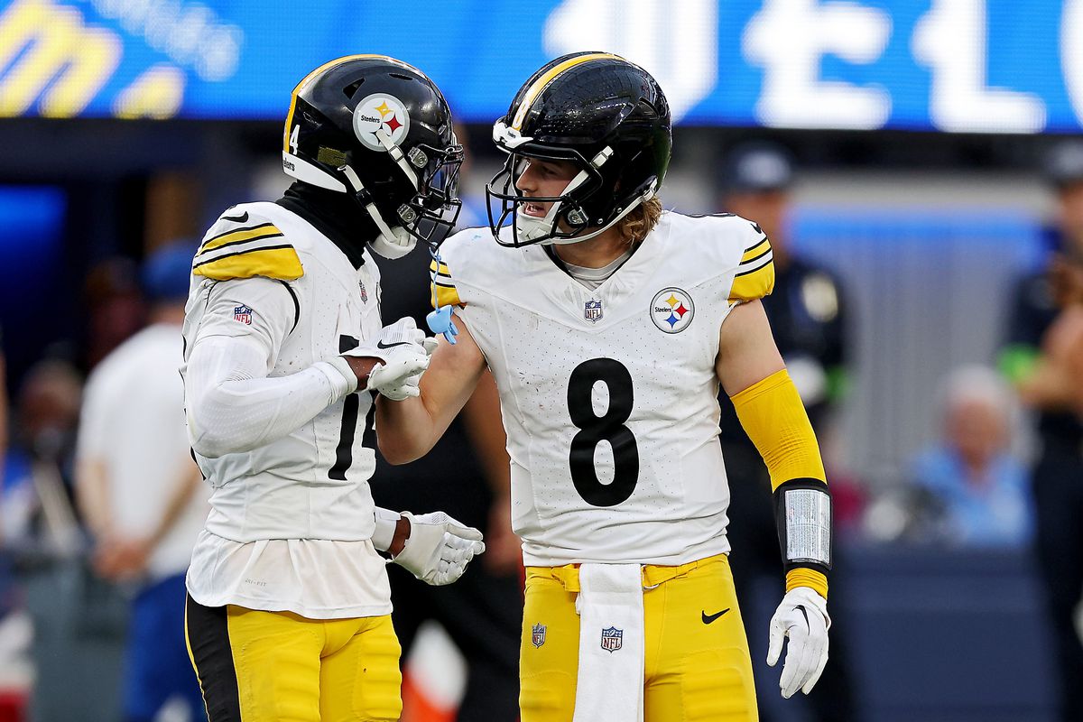 Kenny Pickett #8 and George Pickens #14 of the Pittsburgh Steelers celebrate a pass during the fourth quarter against the Los Angeles Rams at SoFi Stadium on October 22, 2023 in Inglewood, California.