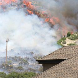 Fire burning near homes in Alpine.