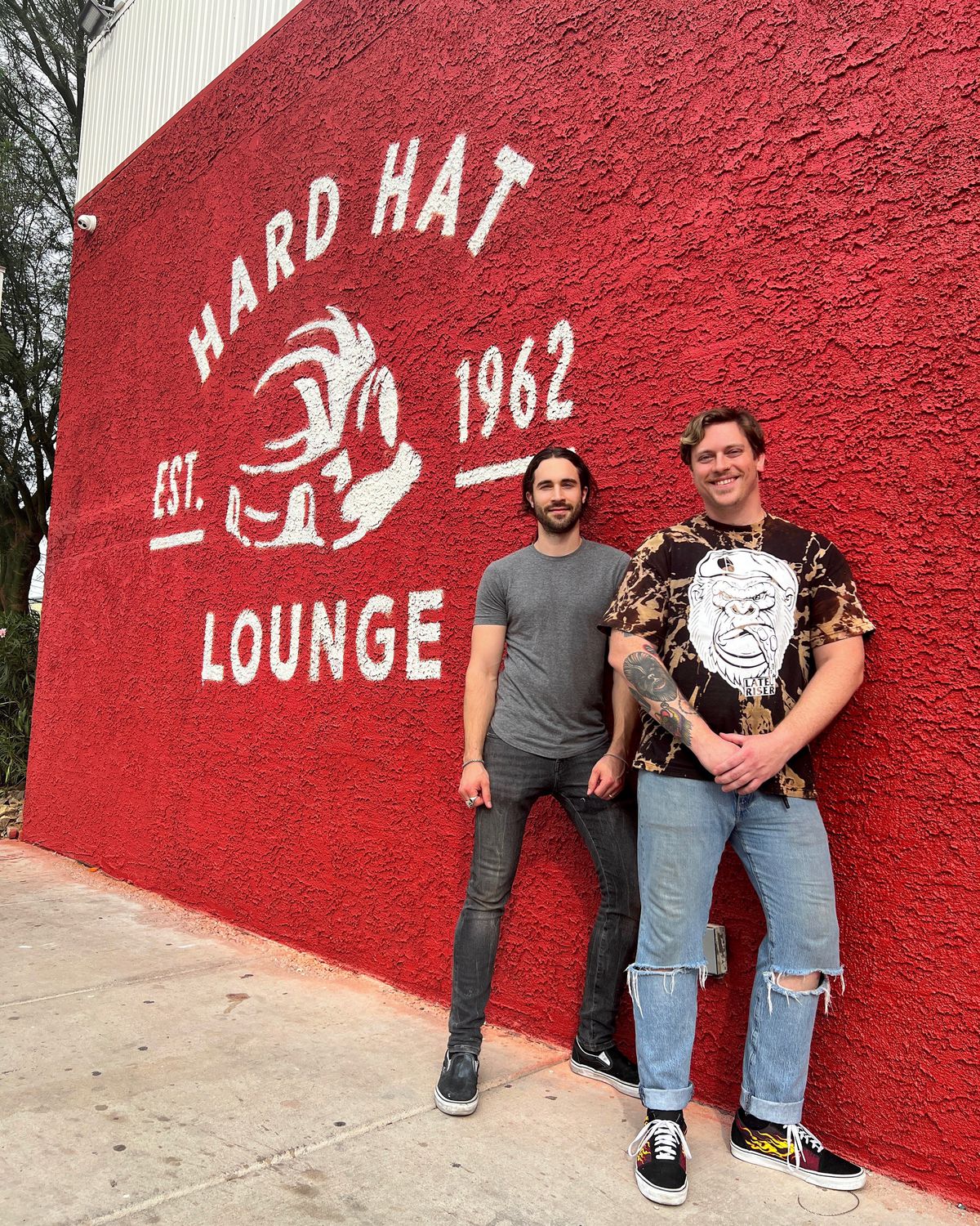Robby Cunningham and Frank Sidoris in front of the Hard Hat Lounge