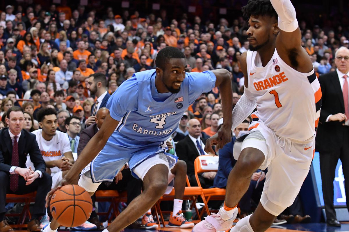 North Carolina Tar Heels guard Brandon Robinson works to break a full court press from Syracuse Orange forward Quincy Guerrier (1) in the second half at the Carrier Dome.