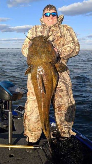 Full length photo of John Phillips 47.5-inch flathead catfish he caught and released Sunday at LaSalle Lake.<br>Provided