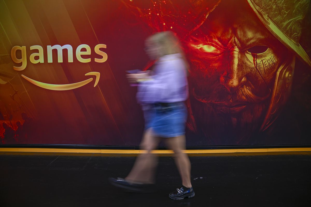 A Visitor pass by the stand of amazon games at the 2023 Gamescom gaming fair on August 23, 2023 in Cologne, Germany. Gamescom is the world’s largest computer and video gaming fair and will run until August 27. —via getty