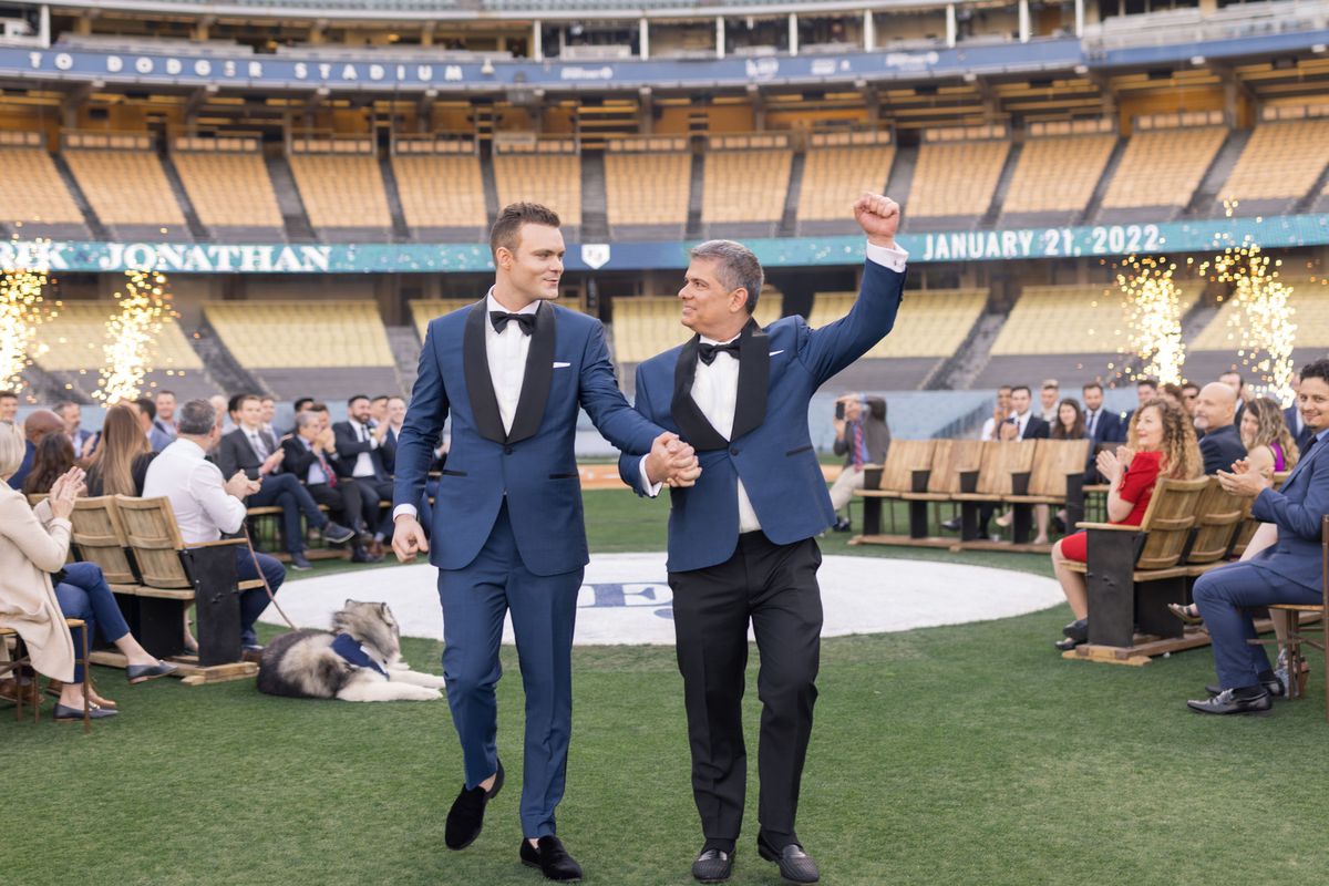 With Dodger Stadium as a backdrop, Jonathan Cottrell, left, and Erik Braverman make their marriage official.