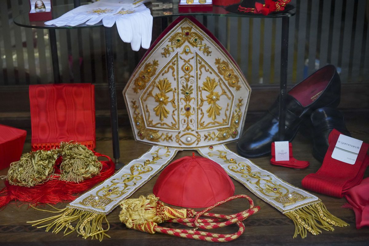 Cardinal clothing accessories are seen on display in the window of the Gammarelli clerical clothing shop, in Rome, Italy.