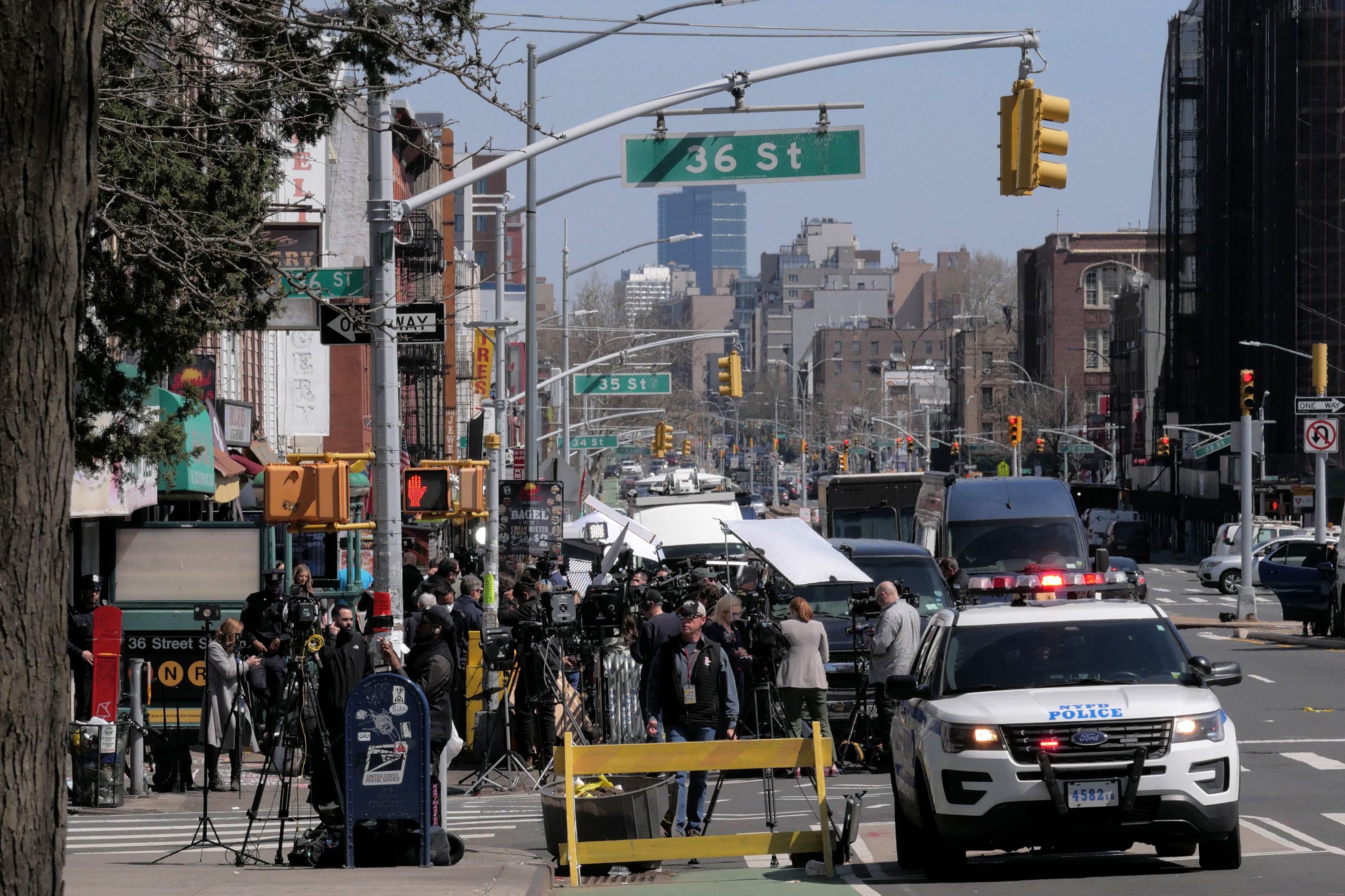Police and media converge on the 36th Street station in Sunset Park. April 13, 2022.