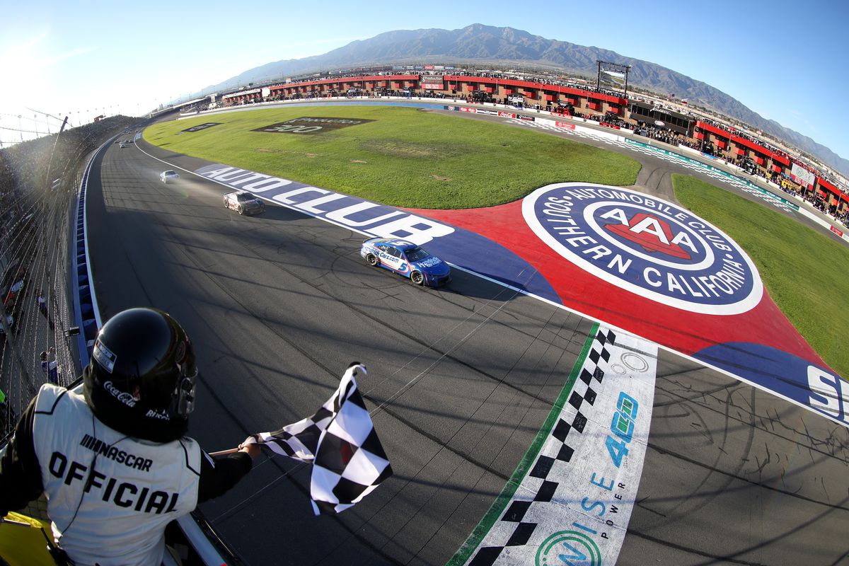 Kyle Larson, driver of the #5 HendrickCars.com Chevrolet, takes the checkered flag to win the NASCAR Cup Series Wise Power 400 at Auto Club Speedway on February 27, 2022 in Fontana, California.