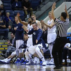 BYU's bench celebrates a three point shot as BYU and BYU-Hawaii play in preseason action at the Marriott Center in Provo on Wednesday, Nov. 9, 2016.