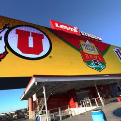 A large video screen shows the Utah Utes and the Indiana Hoosiers logos as the teams prepare to play in the Foster Farms Bowl in Santa Clara, California on Wednesday, Dec. 28, 2016.