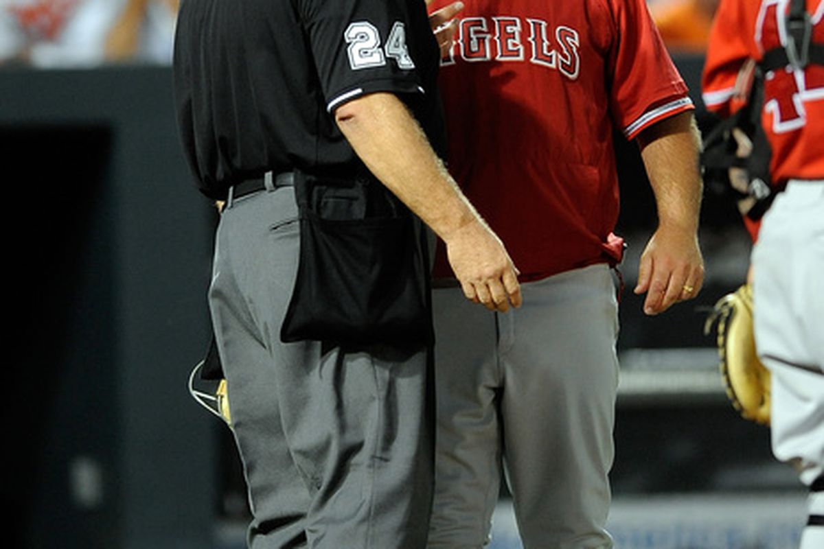 Manager Mike Scioscia of the Los Angeles Angels of Anaheim argues with home plate Umpire Jerry Layne