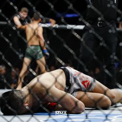 November 10, 2018 — Chan Sung Jung lays unconscious after being knocked out in the final second of the fifth round in his epic bout against Yair Rodriguez where he was knocked out by an upward back elbow.