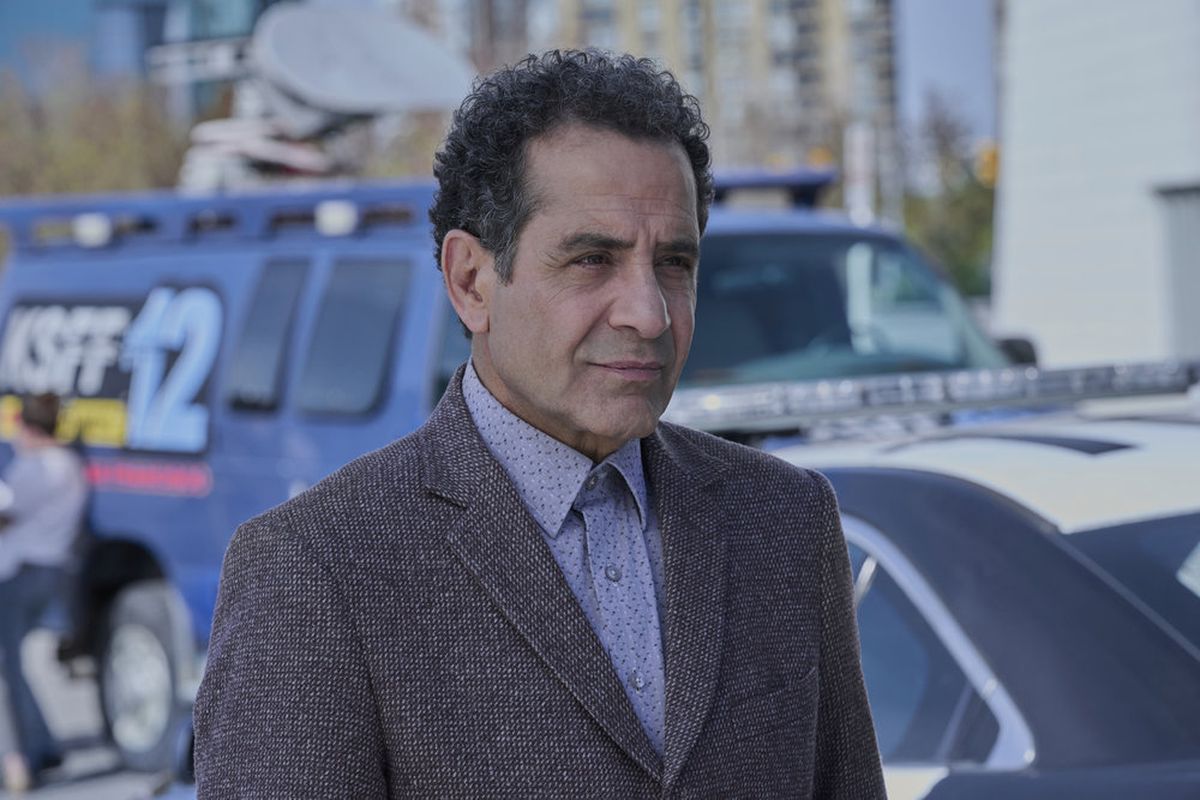Adrian Monk (Tony Shalhoub) standing and looking serious