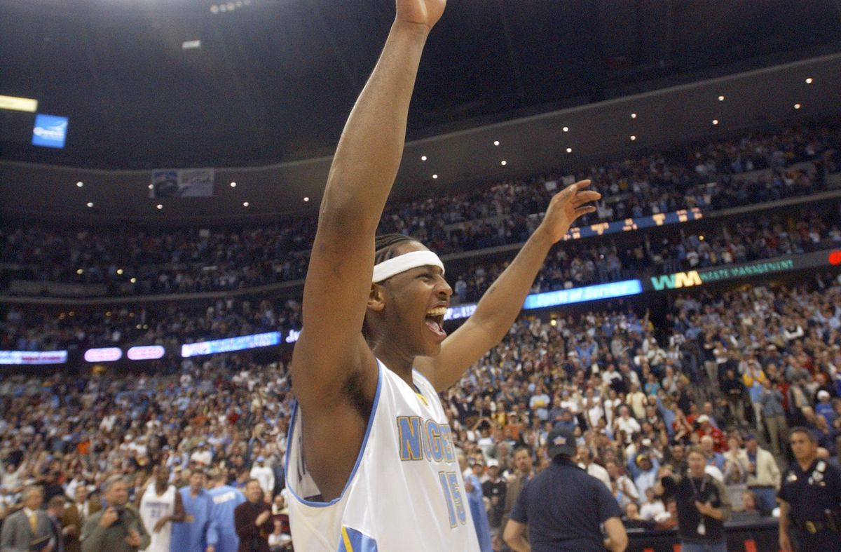 DENVER, CO, APRIL 12, 2004 - NUGGETS VS. KINGS Carmelo Anthony raises his hands in victory. (DENVER POST STAFF PHOTO BY KATHRYN SCOTT OSLER)