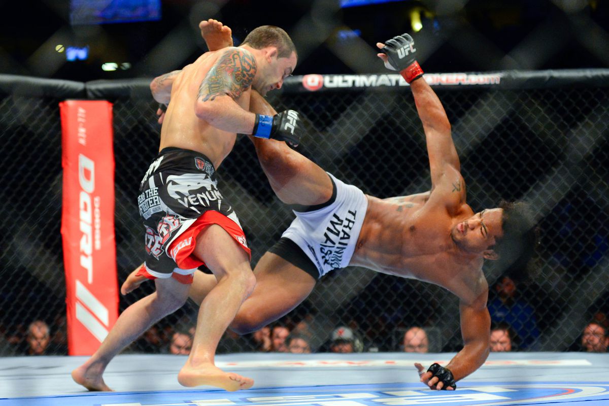 August 11, 2012; Denver, CO, USA; Benson Henderson (right) fights Frankie Edgar (left) during UFC 150 at the Pepsi Center. Mandatory Credit: Ron Chenoy-US PRESSWIRE