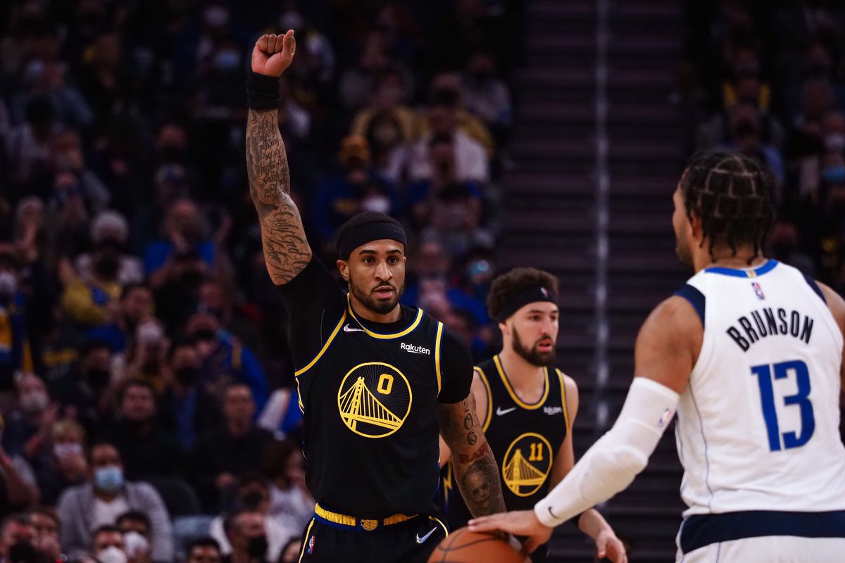 Golden State Warriors guard Gary Payton II (0) gestures as he returns to defense after a play against the Dallas Mavericks during the third quarter at Chase Center.