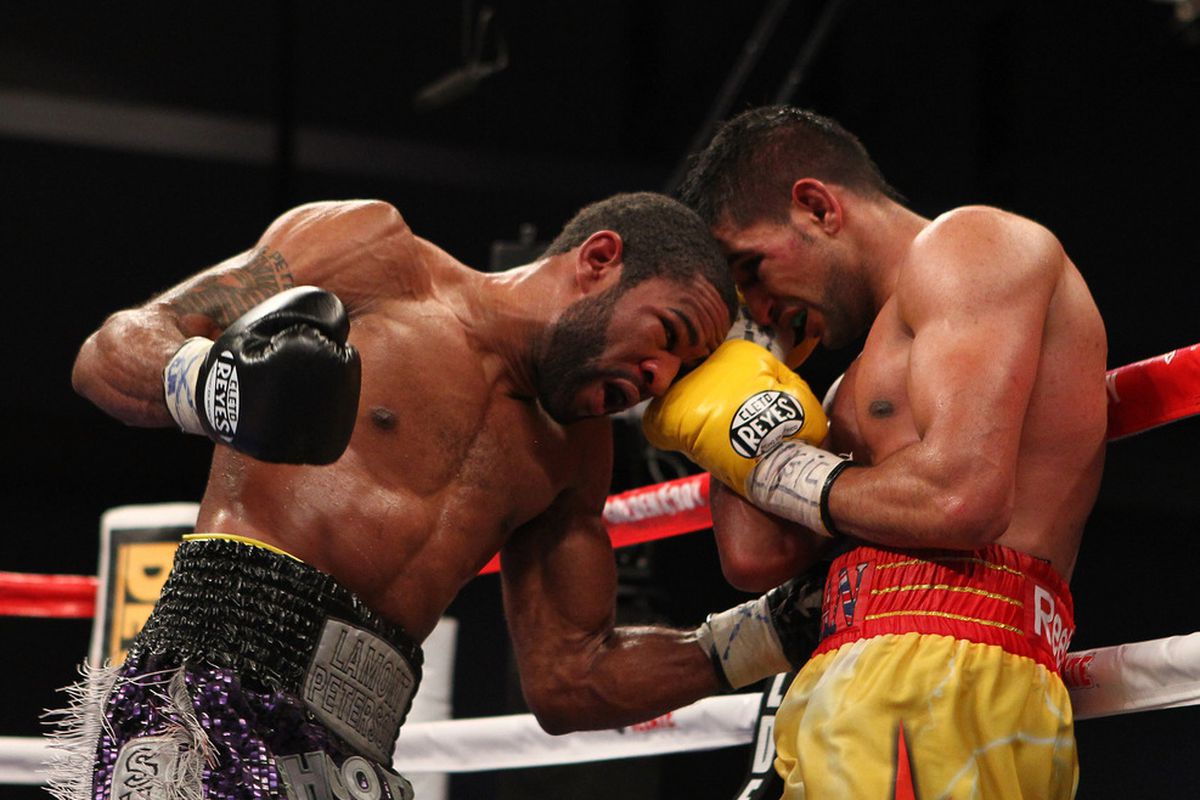Lamont Peterson and Amir Khan will likely rematch, but Team Peterson says a date hasn't been set yet. (Photo by Al Bello/Getty Images)