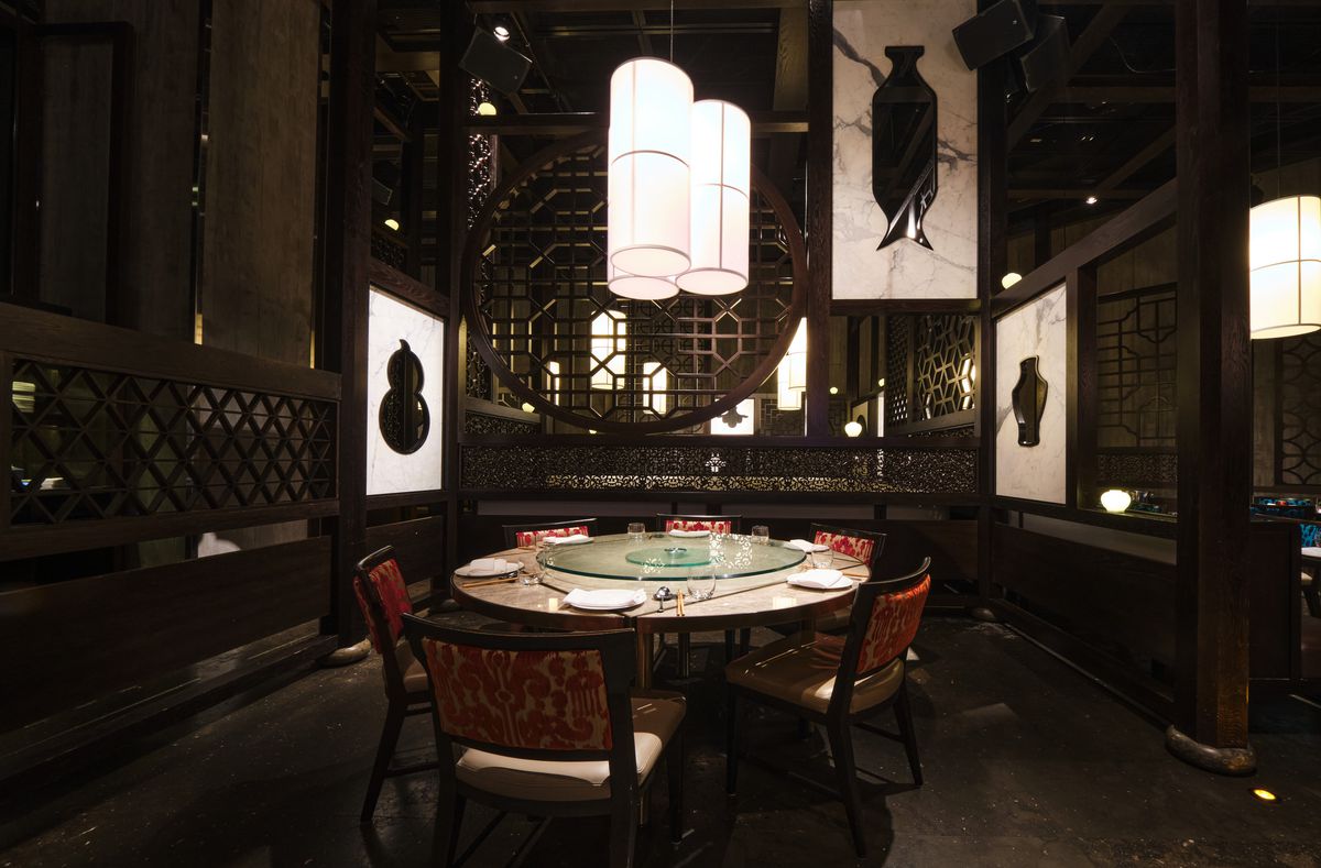 A dark, Asian-inspired dining room